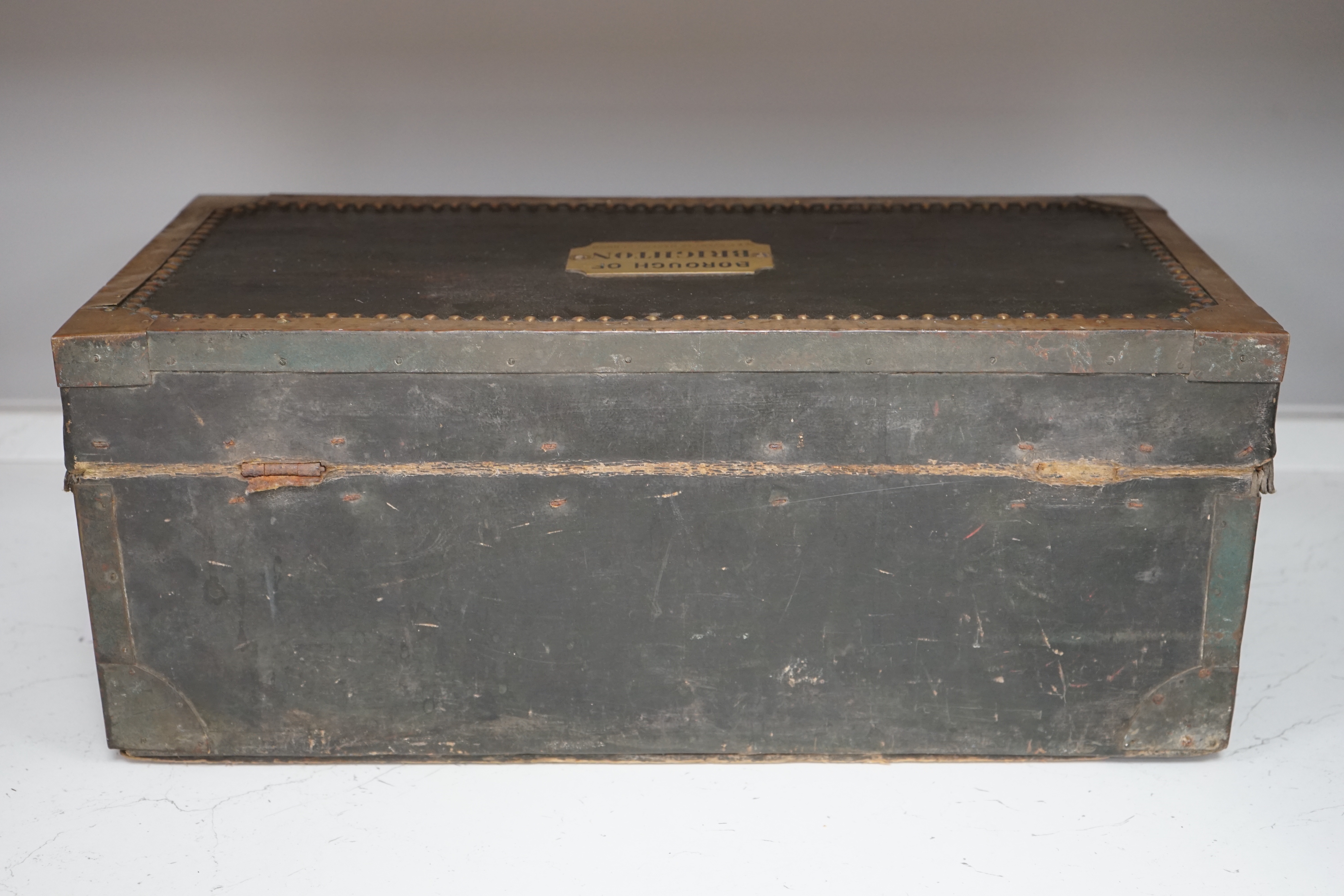 A 19th century leather and brass bound trunk with Avery Ltd applied brass plaque; 'Borough of Brighton', 54cm x 26.5cm x 22cm